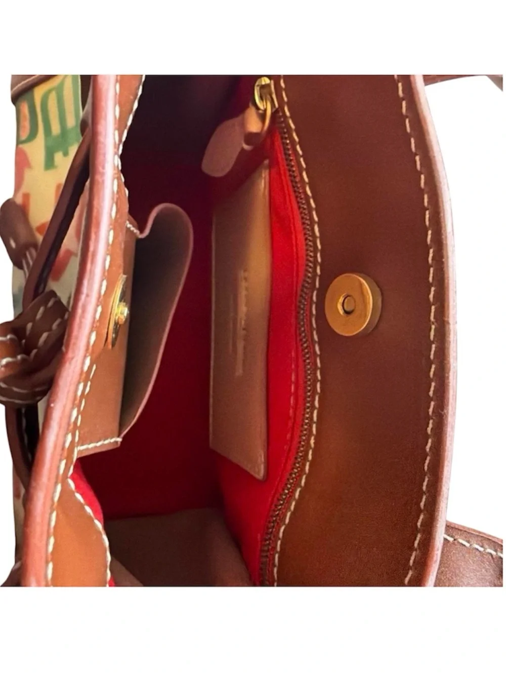 Dooney & Bourke graffiti signature multicolor coated handbag.